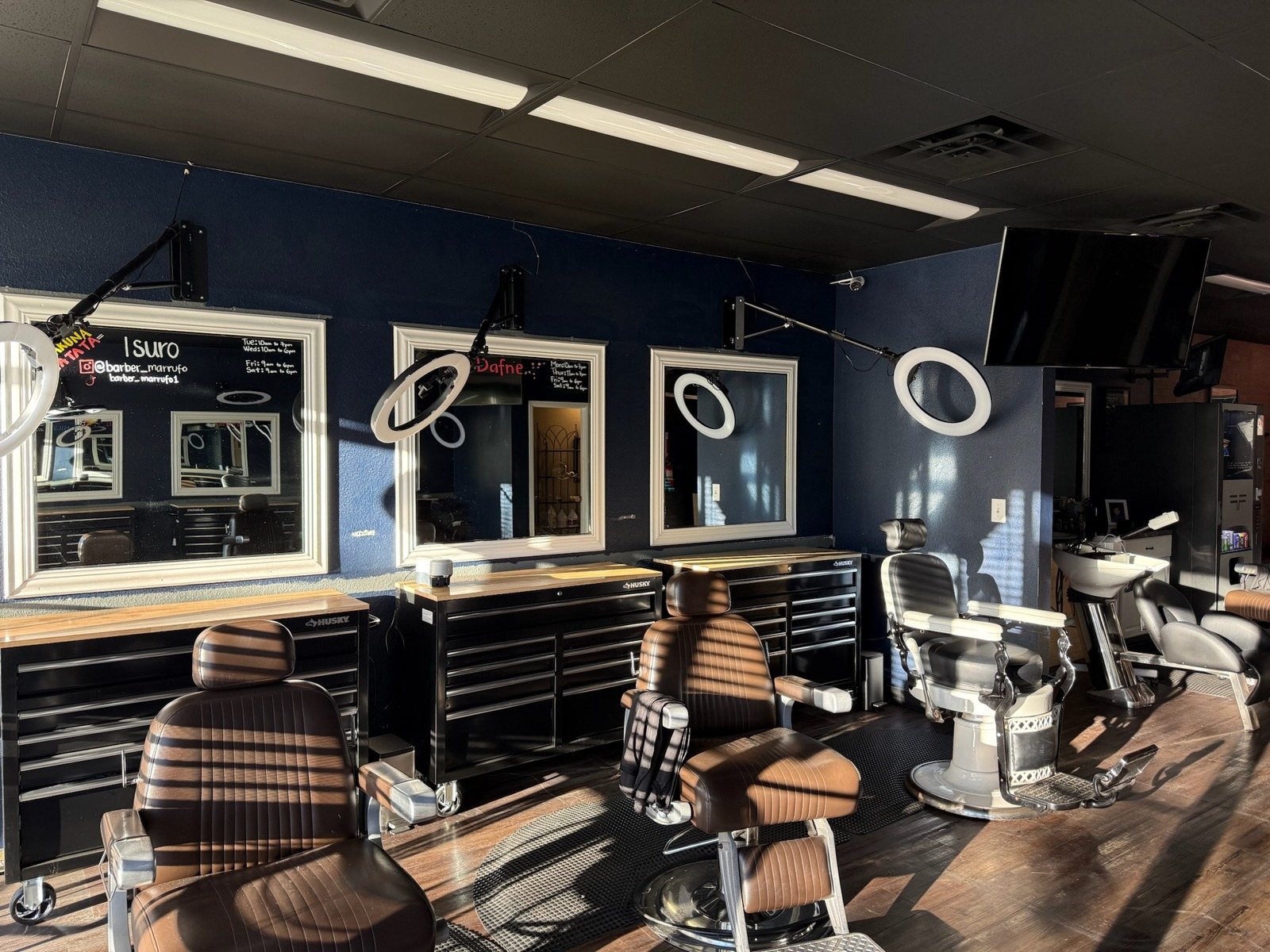 Barbershop with navy accent walls in Fort Collins