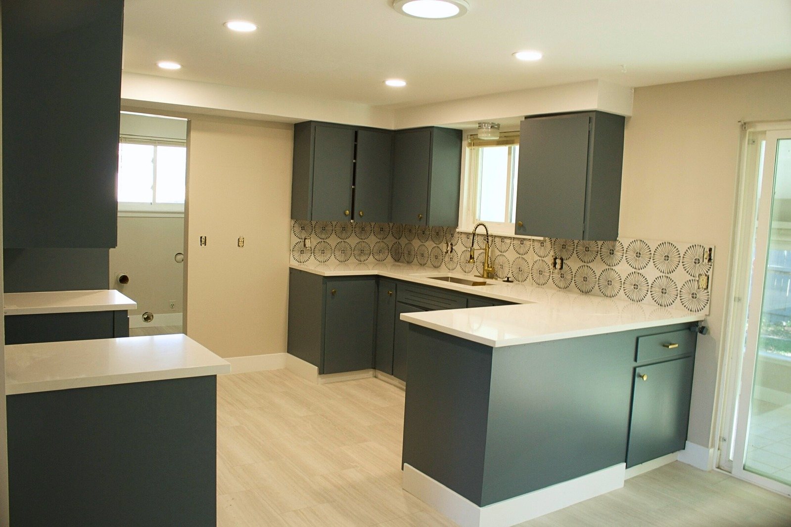 Kitchen with dark green painted cabinets in Fort Collins